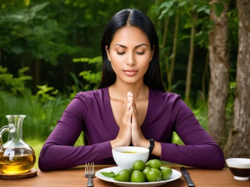 A woman meditating peacefully after a day of fasting