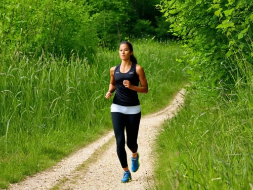 Woman doing outdoor fitness workout exercise in natural environment