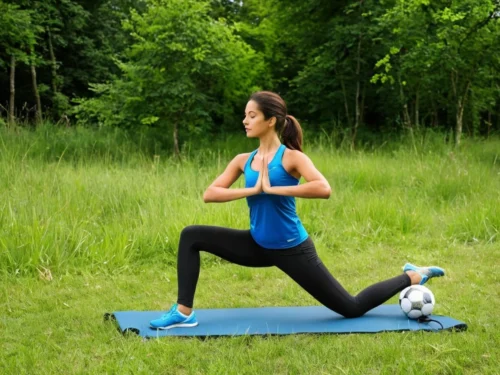 Woman exercising in nature while practicing meditation, combining mindful movement with outdoor fitness