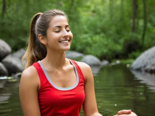 Smiling woman meditating alone in forest demonstrating healthy solitude